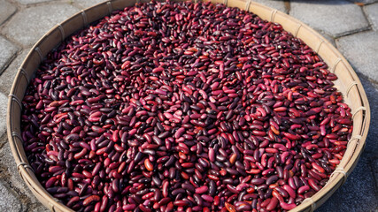 Close up red bean seeds in a bamboo container