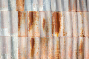 wall of rusty corrugated iron sheets