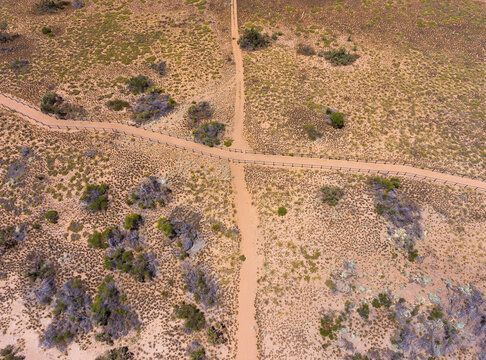 Two Sandy Trails Crossing Seen From Above In Arid Landscape