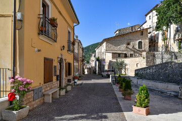Fototapeta na wymiar A narrow street between the old stone houses of Cansano, a medieval village in the Abruzzo region of Italy. 