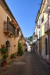 Fototapeta na wymiar A narrow street between the old stone houses of Cansano, a medieval village in the Abruzzo region of Italy. 