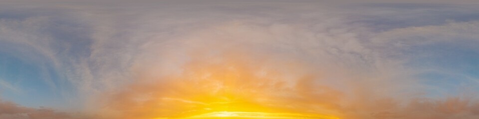 Golden glowing sunset sky panorama with Cirrus clouds. Hdr seamless spherical equirectangular 360 panorama. Sky dome or zenith for 3D visualization and sky replacement for aerial drone 360 panoramas.