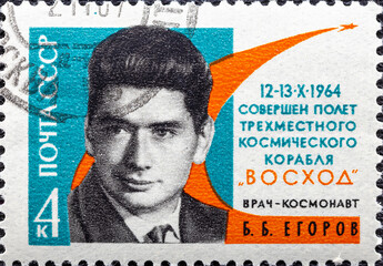 USSR - CIRCA 1964: A stamp printed in the USSR Russia shows a portrait of cosmonaut Yegorov with...