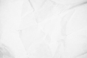 White crumpled recycled craft paper background. Abstract grey material texture old vintage page.	