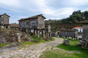Fototapeta na wymiar View of the granaries (espigueiros) in the historic village of Lindoso, Portugal.