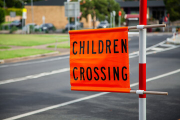 Children crossing sign beside school