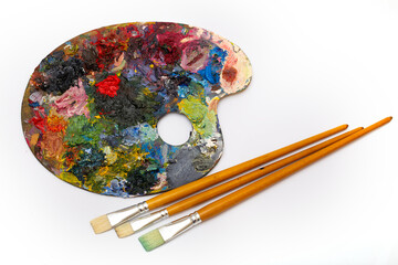 pallette with brushes on a white background