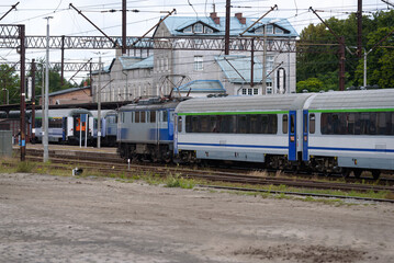 RAILWAY TRANSPORT - Passenger express train enters to station
