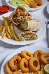 Fast food. Oriental food. Shawarma, pita twists and battered squid. Eastern cuisine dishes.