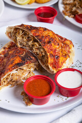 Kebab calzone with various sauces. Fast food