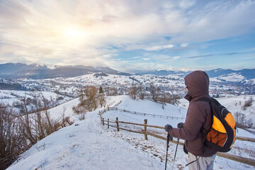 Fototapeta na wymiar man hiking in snowy highland