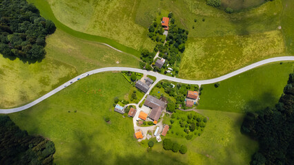 farm yard shot with a street from above with a drone