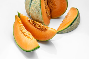 sliced cantaloupe melon. Raw Organic Tuscan Melon Cantaloupe isolated on white background, banner, menu, recipe place for text, top view