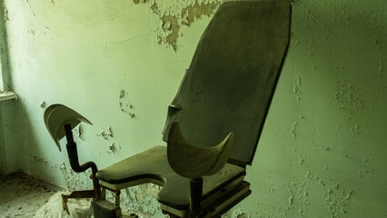 Gynecological examination chair in an abandoned hospital building in the city of Pripyat. Abortion....