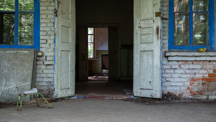 Entrance to the building of an abandoned kindergarten in city Pripyat near Chernobyl nuclear power plant. Exclusion radioactive zone, Ukraine. Radiation, catastrophe