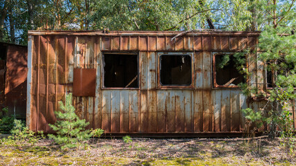 Rusty destroyed abandoned trailer in the ghost city Pripyat after explosion fourth reactor Chernobyl nuclear power plant. Exclusion zone. Radiation, catastrophe. Ukraine