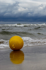 buoy on a stormy beach
