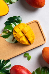Mango background design concept. Top view Diced fresh mango fruit on gray table.