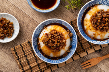 Taiwanese savory rice pudding Wa gui with chopped dried radish and soy sauce