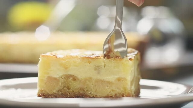 Piece quince crumb cake, served in a plate.