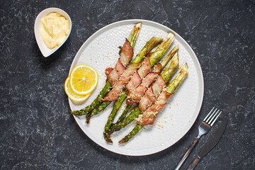 Grilled green asparagus wrapped with bacon. Ketogenic diet. Healthy food, diet menu. Top view