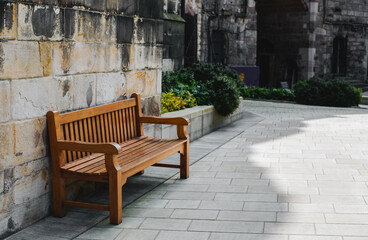 Fototapeta na wymiar Beautiful bench in the courtyard of the castle
