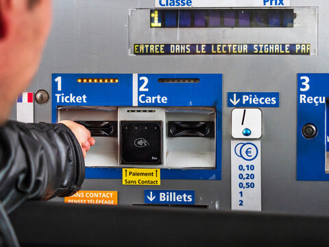 Toll roads in France. Payment at the checkpoint of cars.
