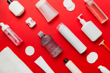 Naklejka premium Mockup for bathing products top view flat lay, spa razor, toothpaste, soap, gel and other various accessories. Cosmetics for skin health. Bath Mockup for your logo