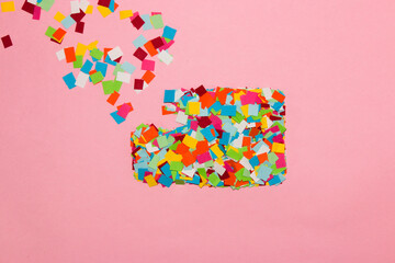 colorful sheet of paper falling apart on pink background, creative idea, creative modern design,...