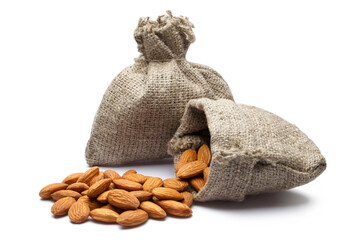 Delicious almonds in burlap sacks, isolated on white background