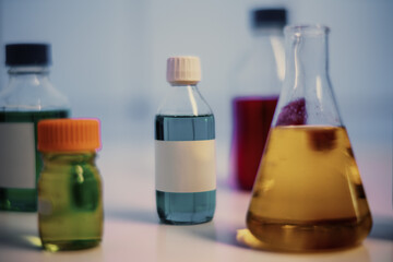 chemical bottle with blank sticker in chemistry lab