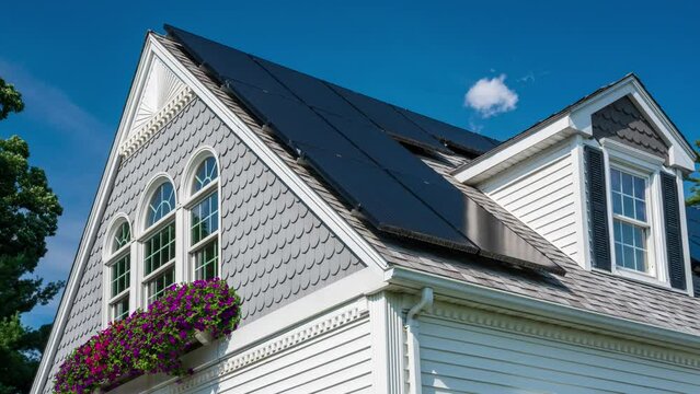 Timelapse of Solar Panels on a house. High quality 4k footage with clouds in the background