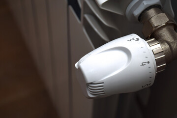 Concept image of energy saving - heating regulator thermostat in close-up