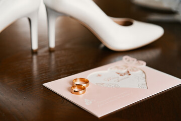 bride's shoes with rings