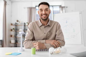 distance education, school and remote job concept - happy smiling male teacher having online class or video call at home office