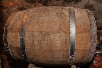 Oak barrel in the basement for long-term aging of alcoholic beverages.