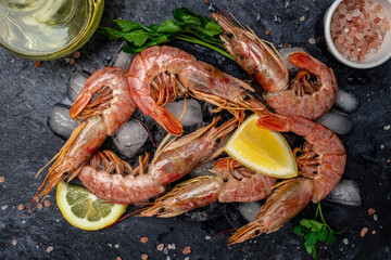 Seafood. Red Argentine shrimps with salt and lemon, Wild shrimps, ocean jumbo shrimps on a dark...