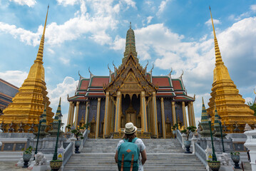 Naklejka premium Traveler woman at Wat Phra Kaew, Emerald Buddha temple, Bangkok Thailand.