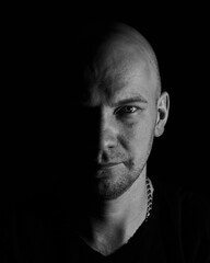 a man on a black background with one light source on the side