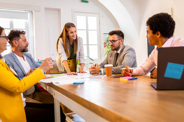 Group of business people working in office.
