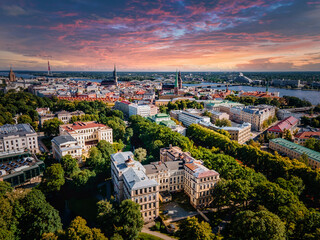 Aerial view of the Riga center in Latvia at sunset. Beautiful historical buildings, old town and River Daugava