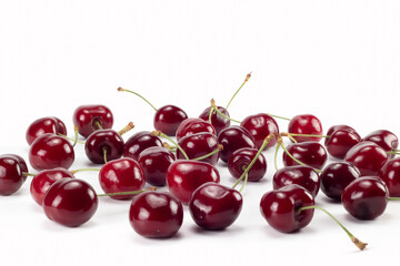 A lot of ripe cherries scattered on bright background. Close up view.