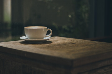cup of coffee on wooden table