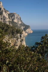 Fototapeta na wymiar Italian marine landscape. Detail of a characteristic portion of the Italian coast, with the mountains overlooking the sea.