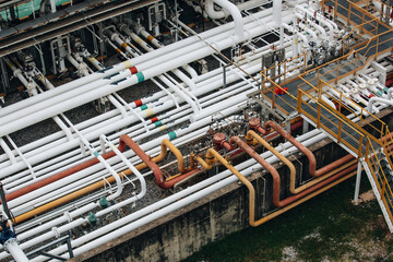 Steel long pipes flowing symbol and pipe elbow in station oil factory during refinery...