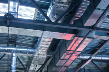 Air conditioning, ventilation ducts and heating pipes of buildings. Industrial background
