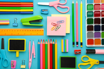 School supplies on blue background. Back to school concept.