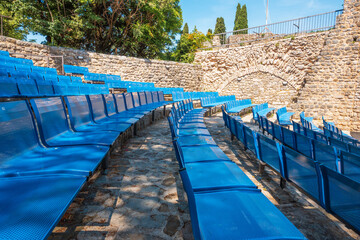 Blue chairs in the amphitheater. Stari Bar fortress in Montenegro. Europe