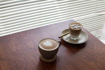 Cup of coffee latte on wooden table