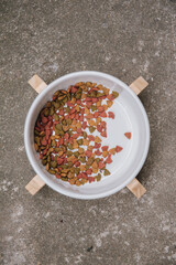 Top view of wooden custom display for pet food bowl. Handmade cat dining table.